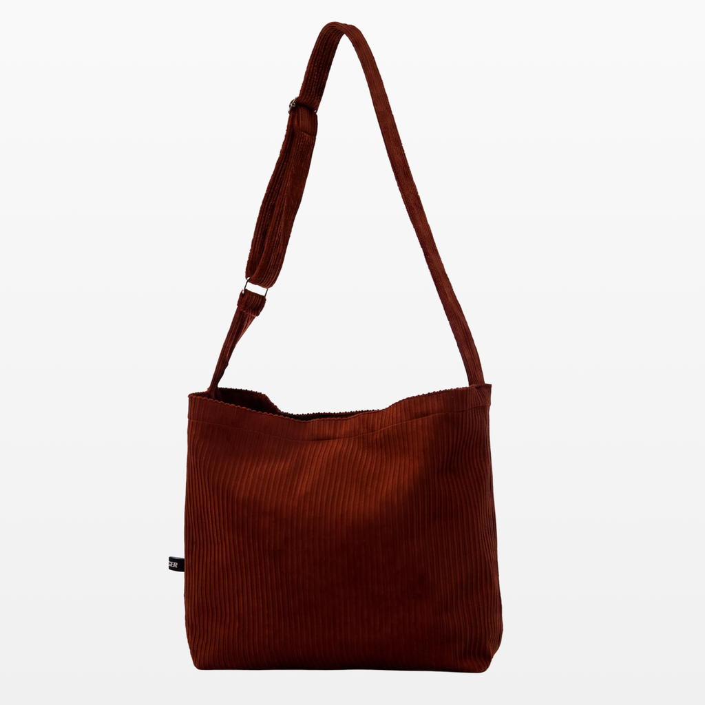 BIRGER rust brown corduroy sling bag, front view
