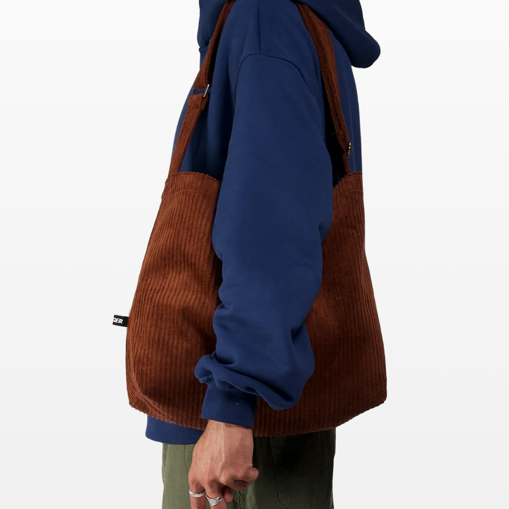 BIRGER rust brown sling bag worn over the shoulder
