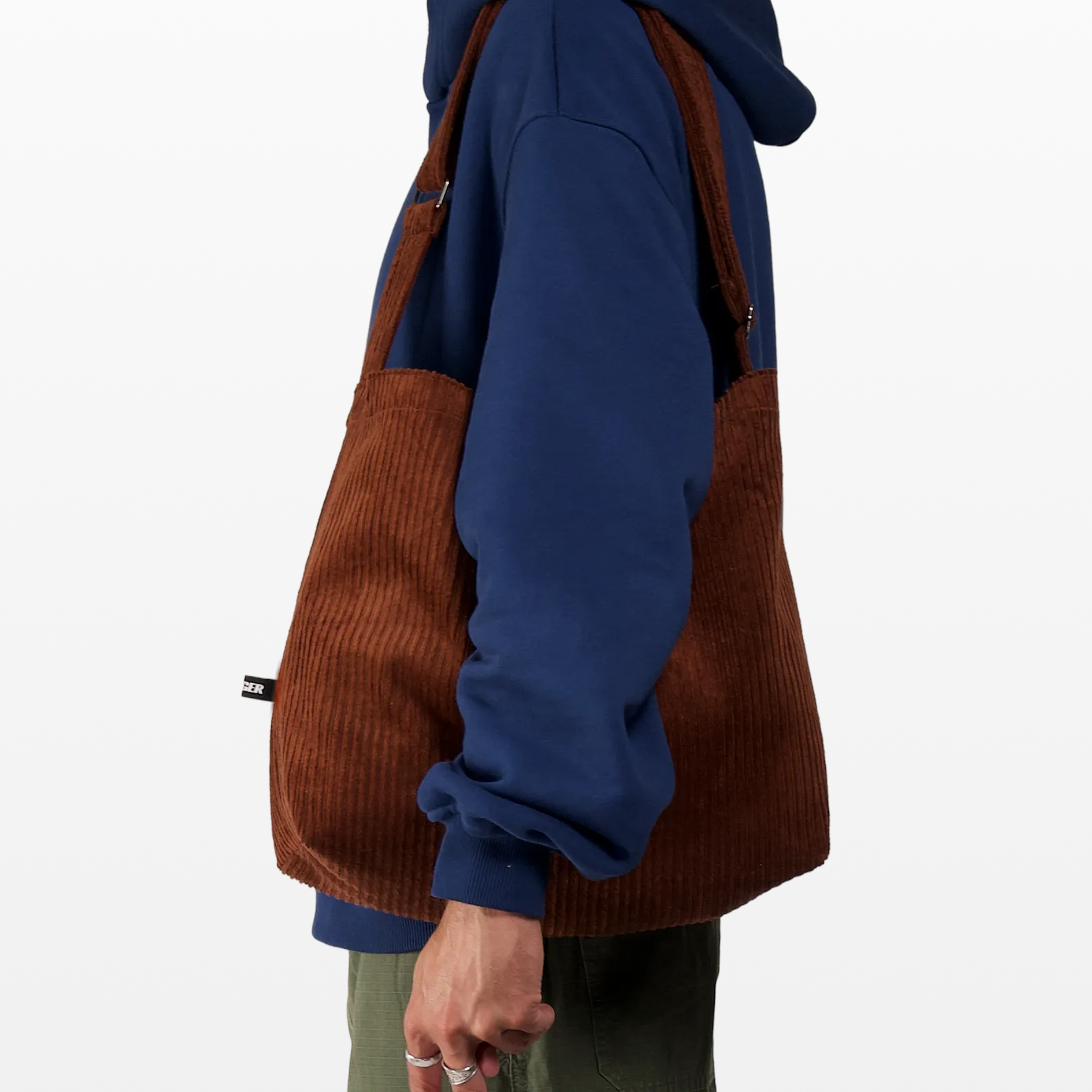 BIRGER rust brown sling bag worn over the shoulder
